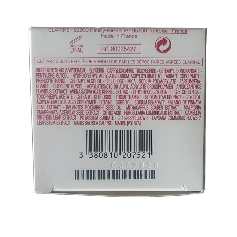 Back of a Clarins product packaging with text and barcode on a white background